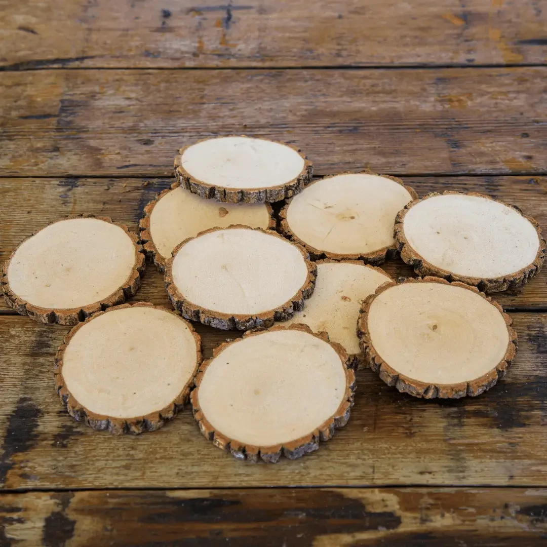 Set of natural wooden log slices with rustic bark edges for laser engraving, resin art, DIY crafts, coasters, and home decor