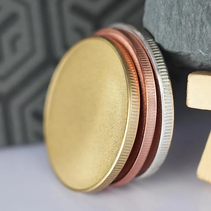 Blank round metal engraving coins in gold, silver, and copper finish for laser engraving and custom coin projects.