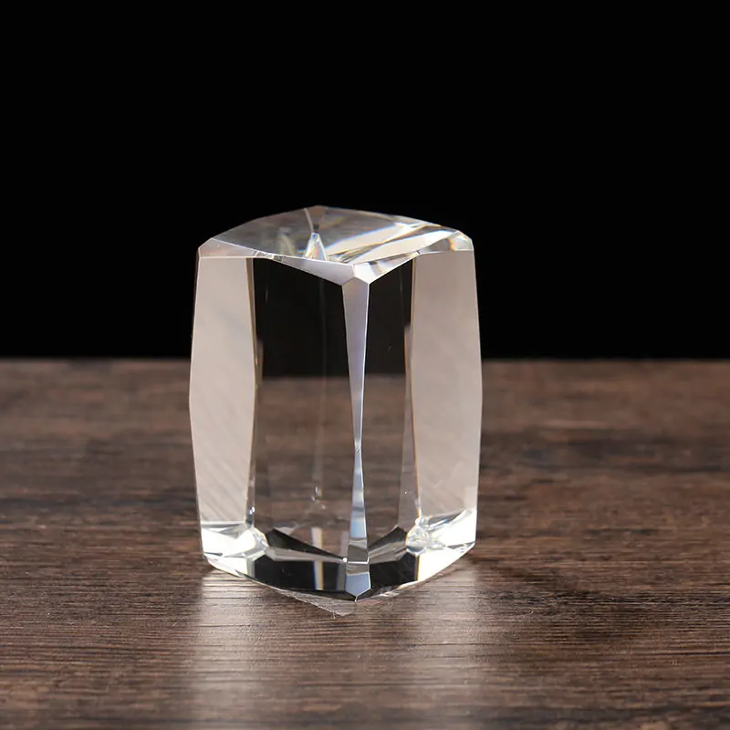 Clear crystal diamond-shaped blank engraved trophy block on a wooden surface, suitable for laser engraving, UV printing, personalized gifts, awards, and keepsakes.