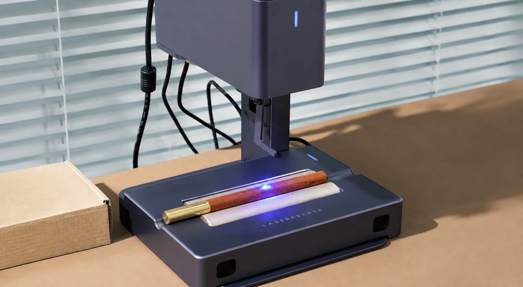 LaserPecker electric roller engraving a cylindrical object